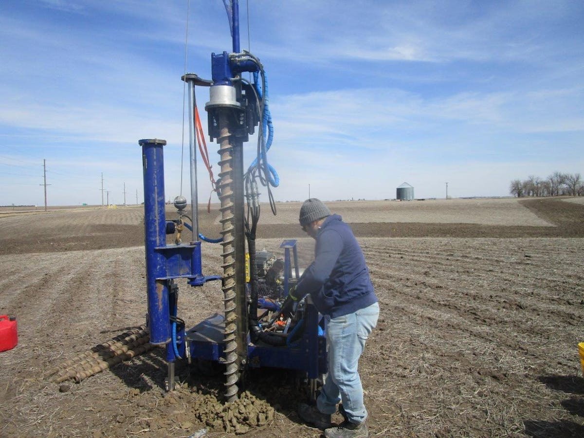 AE Team member working on geotechnical drill rig 